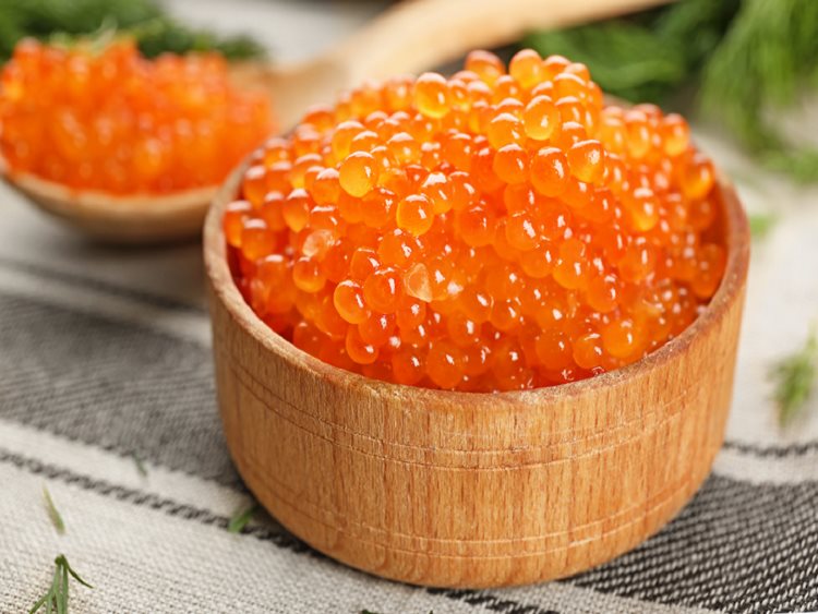 Alaska salmon caviar is great paired with cream cheese, green onions, and bagels.
